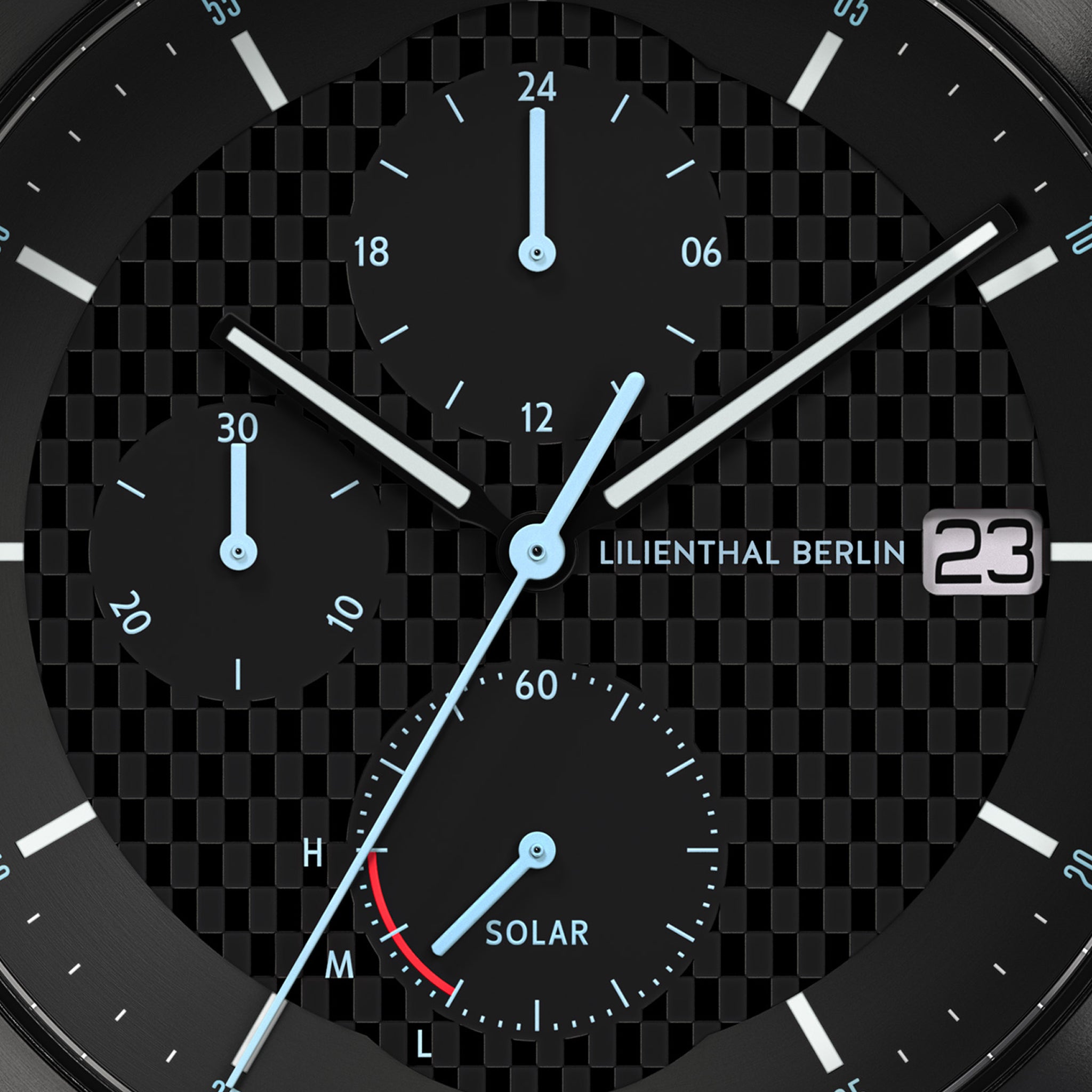 Close-up of chronograph solar watch dial with subdials, date display, and textured background