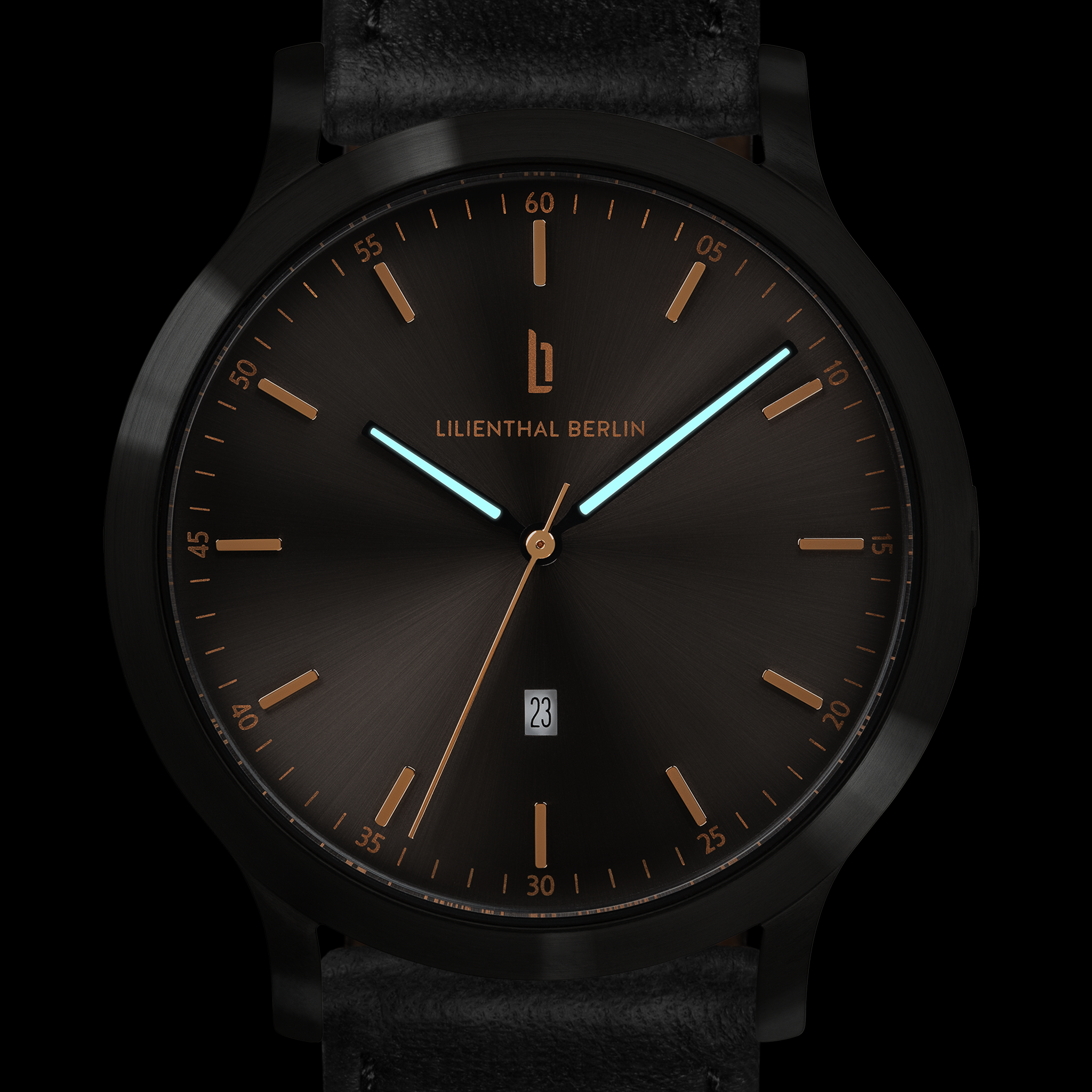 Minimalist black watch with gold hour markers, blue hands, date window, and leather strap