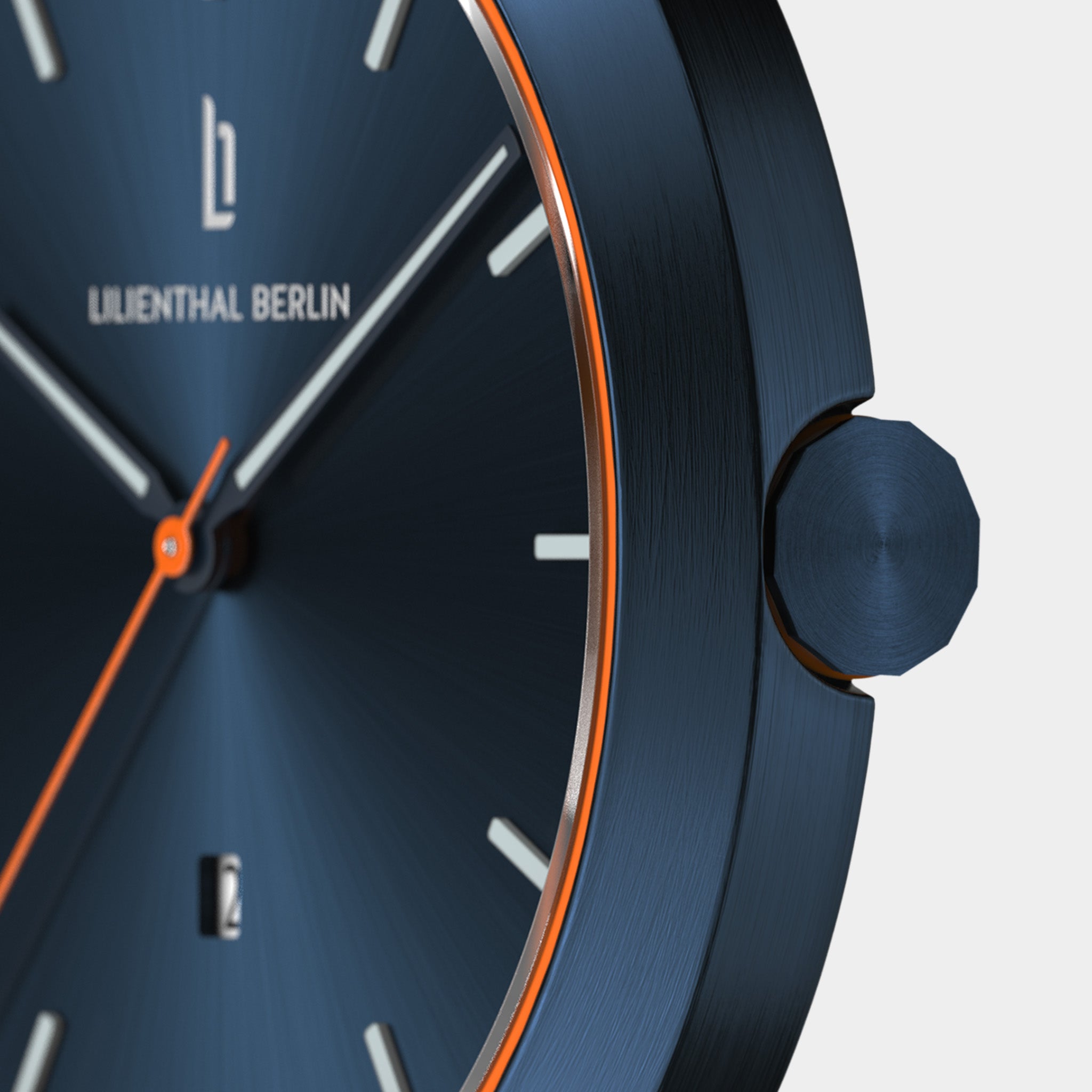 Close-up of a modern blue watch face with orange accents, sleek hands, and minimalist markers