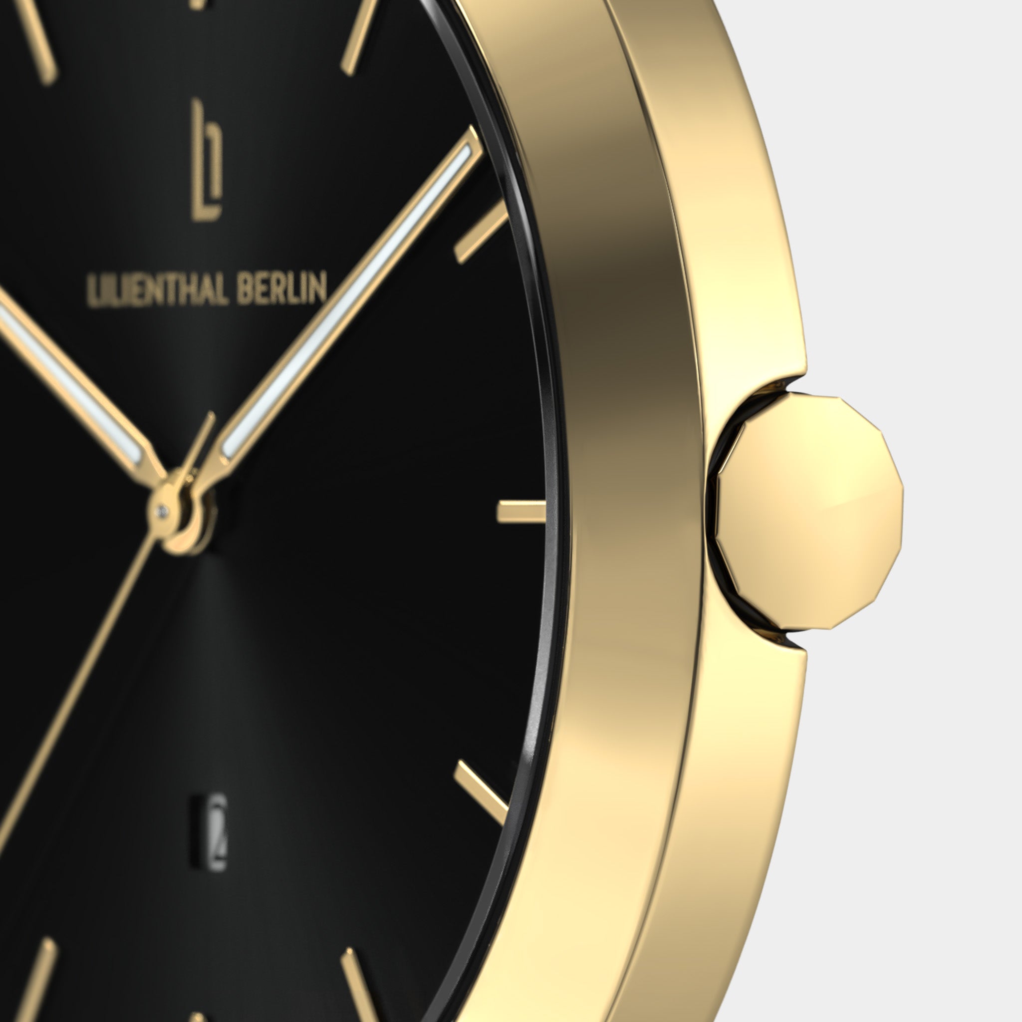 Close-up of gold minimalist wristwatch with black face and gold markers