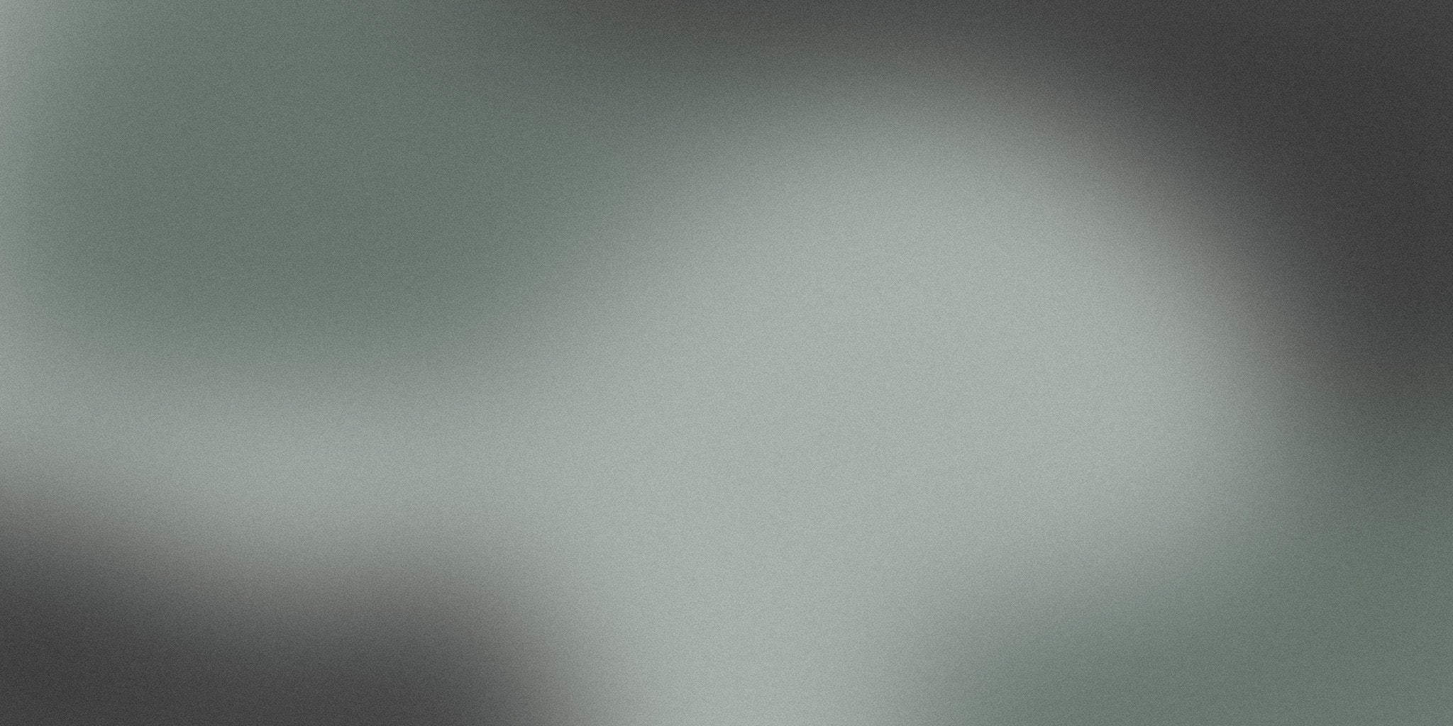 Soft green and gray gradient abstract background with subtle texture