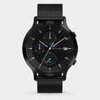 Black solar-powered chronograph watch with mesh strap, checkerboard dial, date display