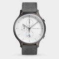 Minimalist men's chronograph watch with grey strap, white dial, and date display
