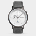 Minimalist men's chronograph watch with grey strap, white dial, and date display