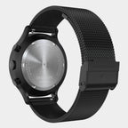 Stainless steel chronograph watch with black mesh strap and engraved case back