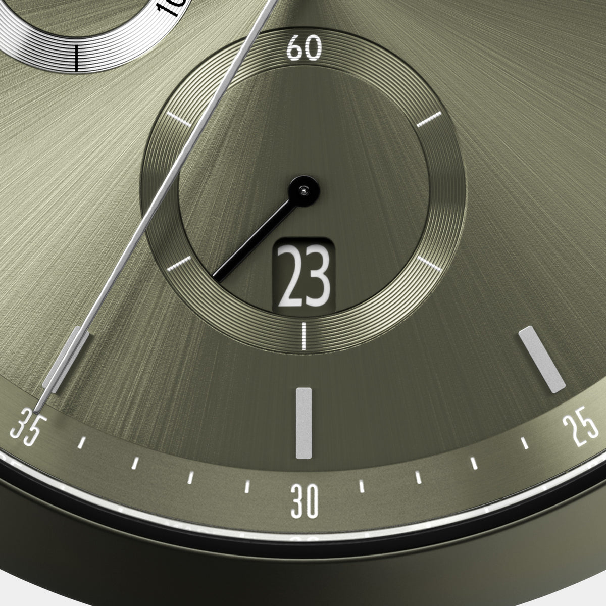 Close-up of olive green watch face with date window, silver markers, and subdial.