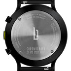 Stainless steel chronograph watch case back with engraved details and logo