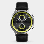 Men’s black chronograph watch with yellow accents, subdials, date display, and leather strap.