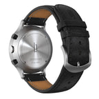 Stainless steel chronograph watch back with black leather strap and engraved details