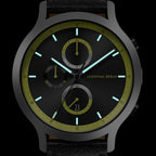Black chronograph watch with green accents, luminous hands, subdials, and date display