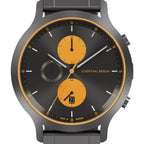 Modern chronograph watch with black dial, orange subdials, date display, and grey strap