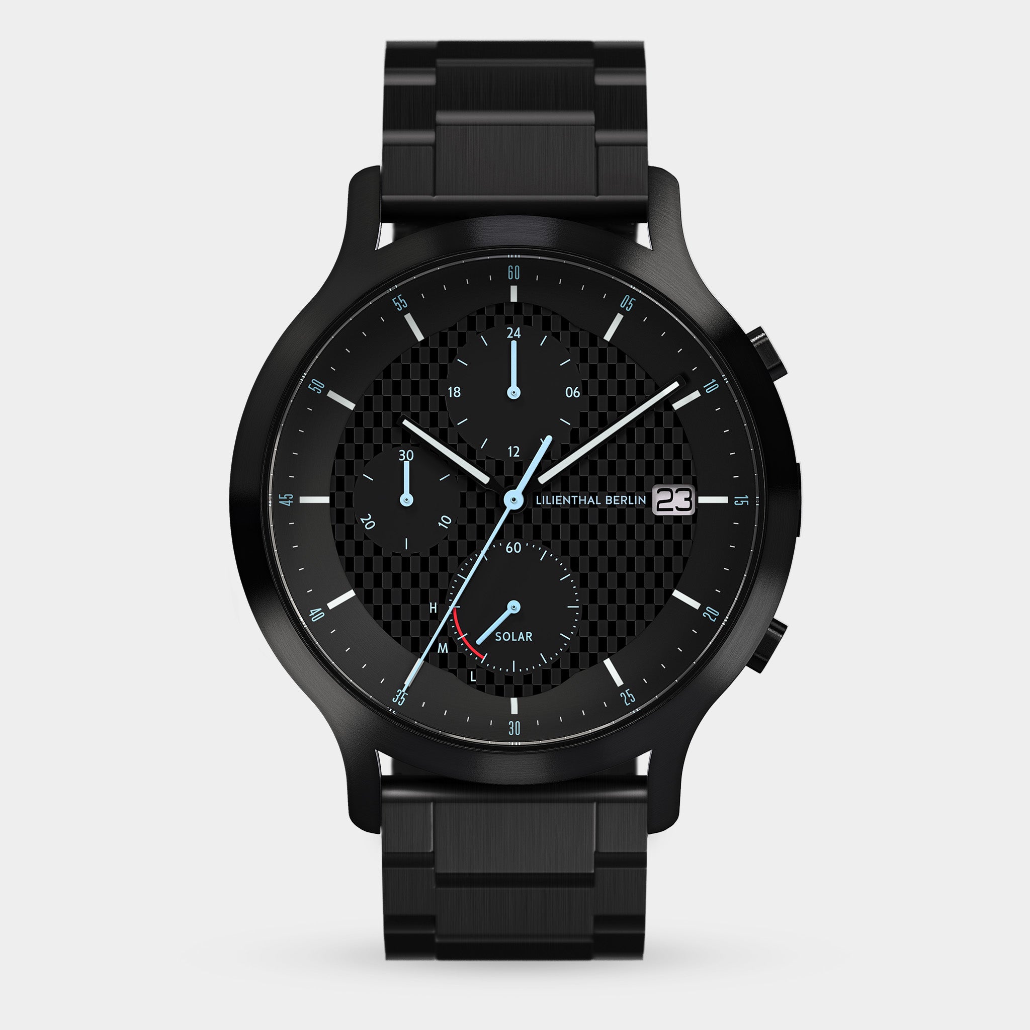 Black chronograph watch with solar dial, metal strap, and checkered black face