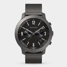 Minimalist black chronograph watch with mesh strap and date display on white background