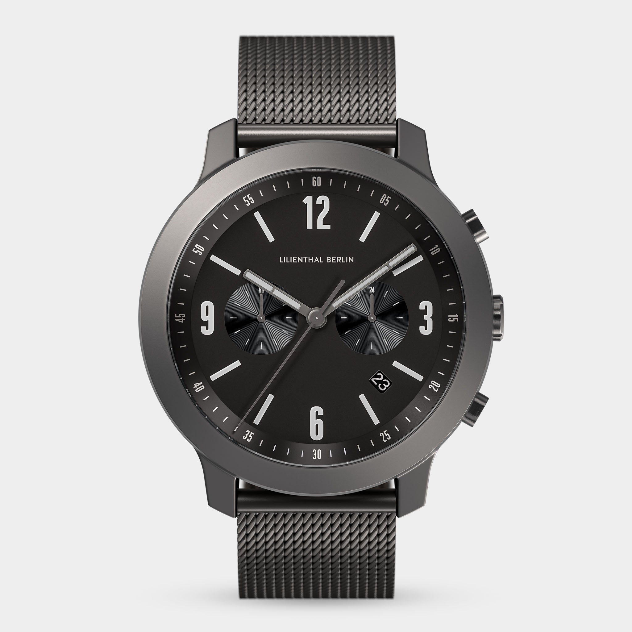 Minimalist black chronograph watch with mesh strap and date display on white background