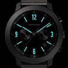 Modern black chronograph watch with turquoise dial accents and a mesh strap