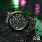 Black chronograph wristwatch with neon green hour markers, metal strap, and award badge.