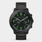Black chronograph wristwatch with green hour markers and black metal band on white background