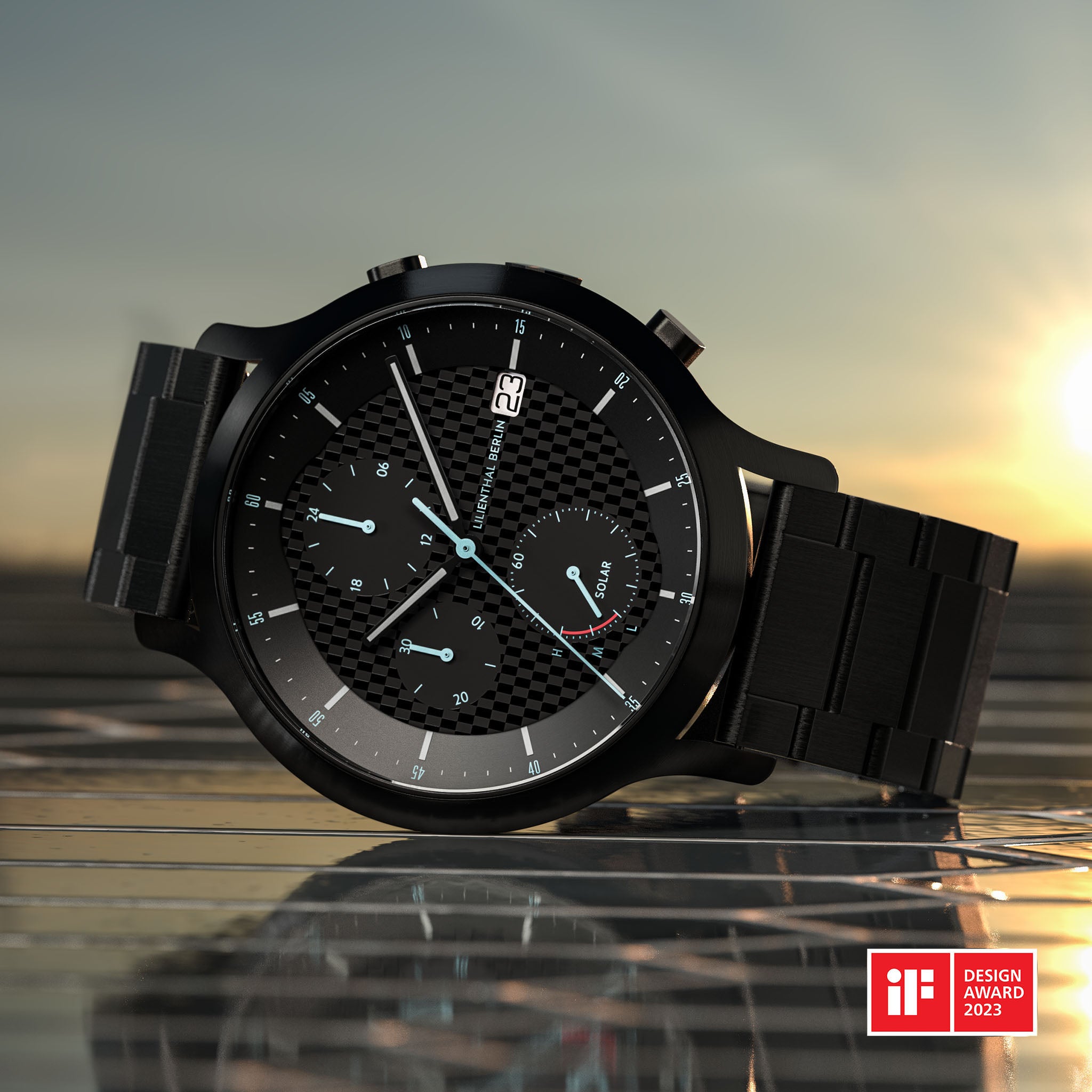 Black solar-powered chronograph watch with textured dial, metal band, and iF Design Award 2023 badge