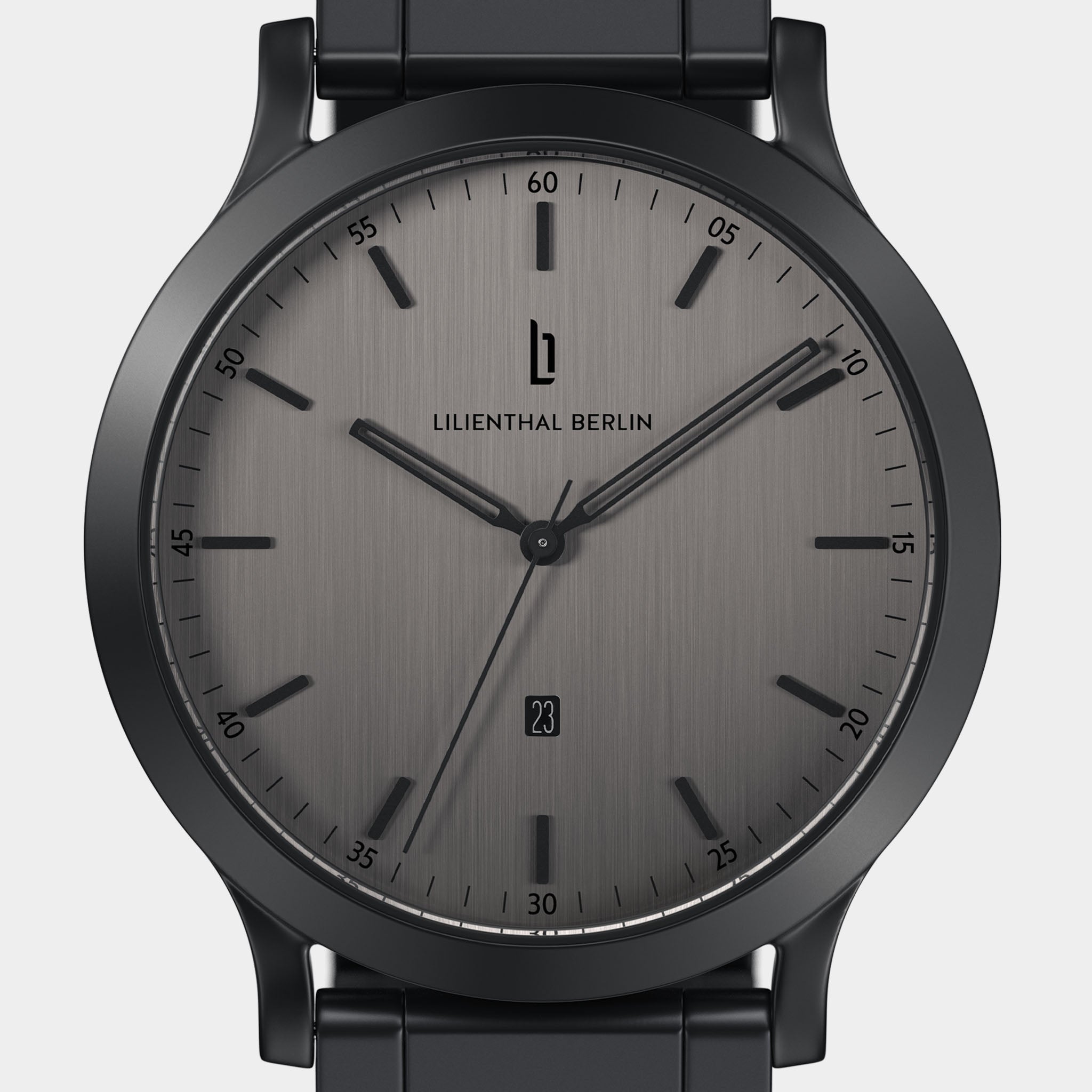 Minimalist black wristwatch with brushed gray dial, date window, and black metal strap