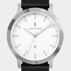 Minimalist silver wristwatch with white dial, mesh strap, and date display at 6 o'clock