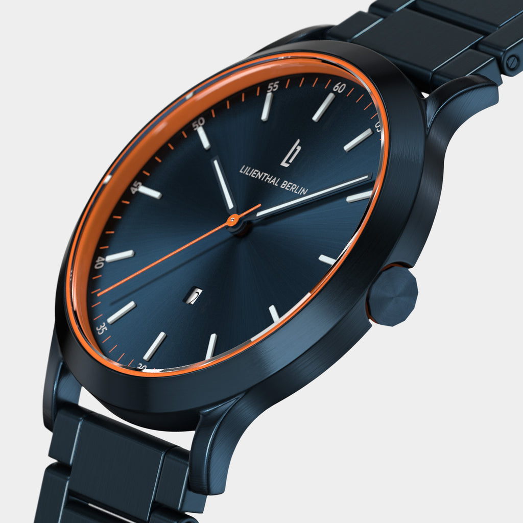 Sleek blue metal wristwatch with orange accents and minimalistic watch face on white background