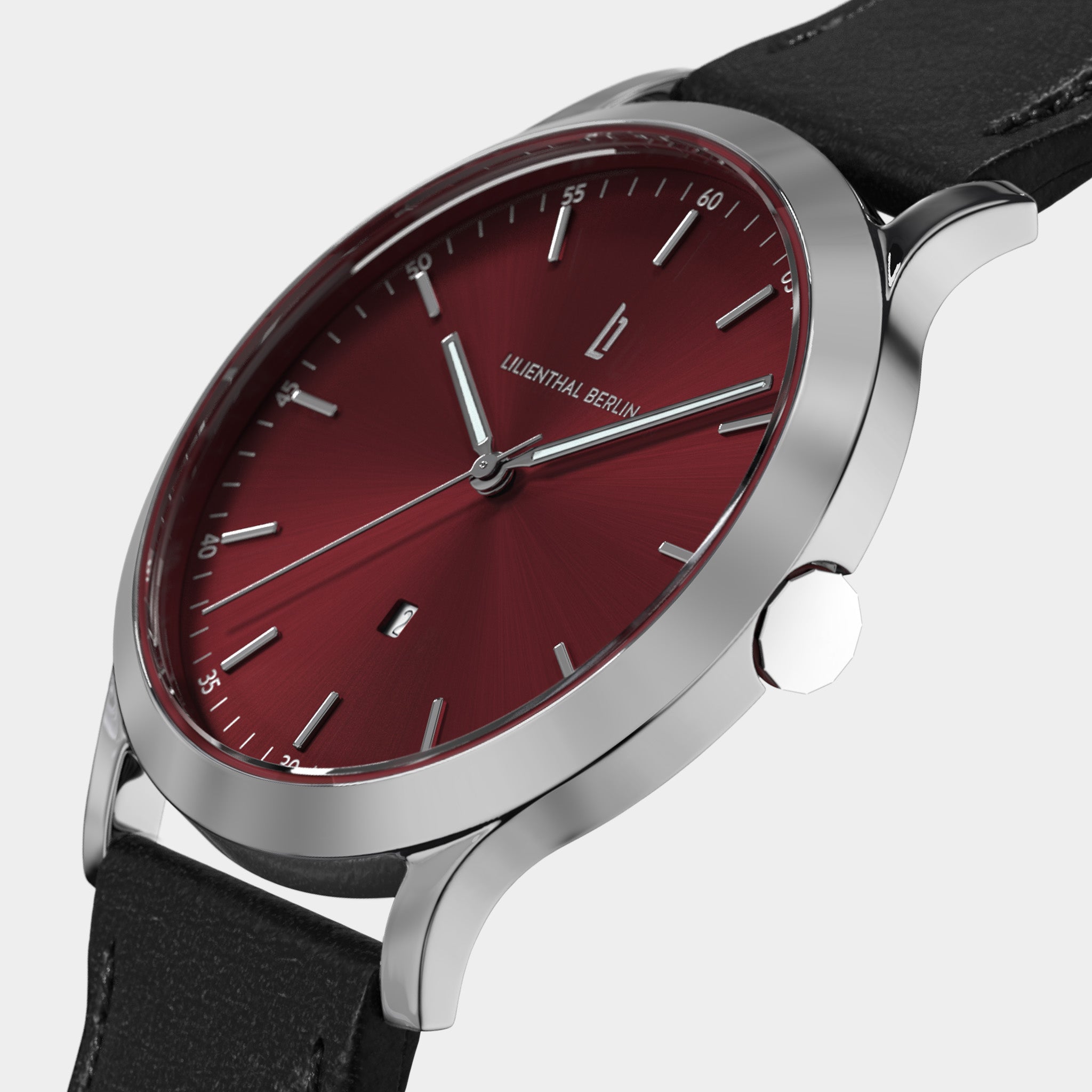 Silver wristwatch with red dial, minimalist design, black leather strap, modern watch style