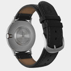 Stainless steel watch back with engraved logo, black leather strap, silver buckle