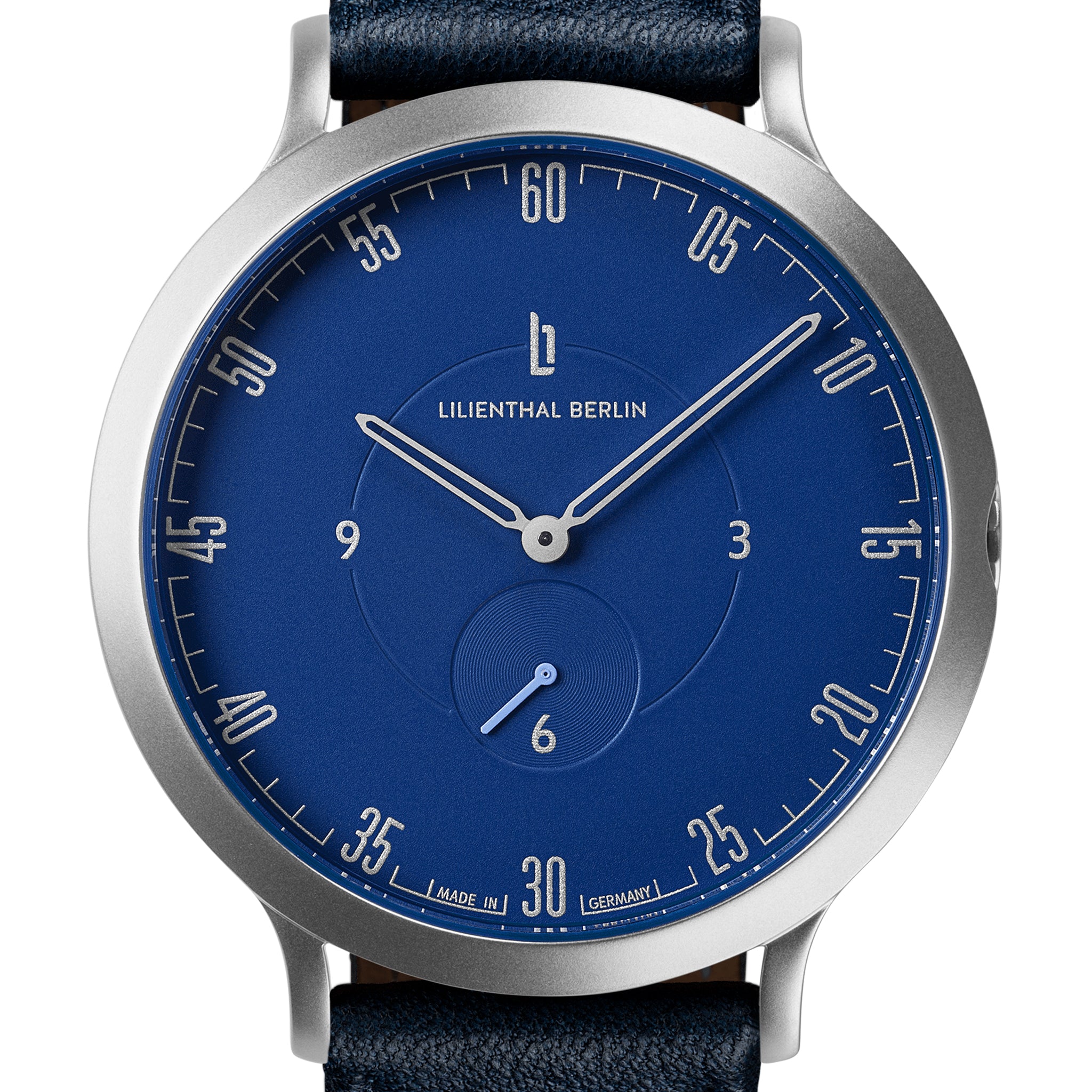 Minimalist blue watch face with silver hour markers, subdial, and leather strap